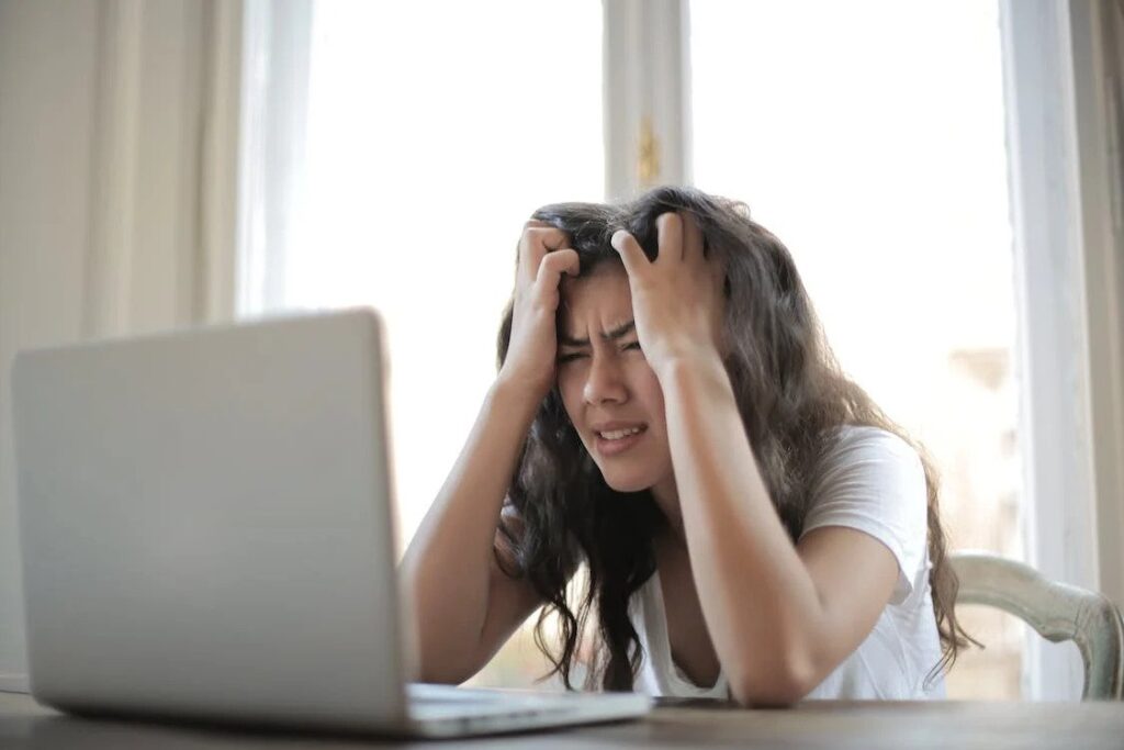 image of a working woman struggling from stress and anxiety