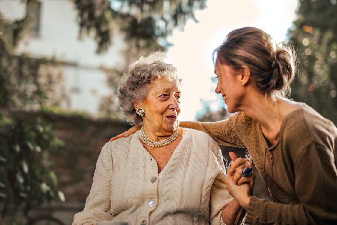 Image of happy old woman with her daughter