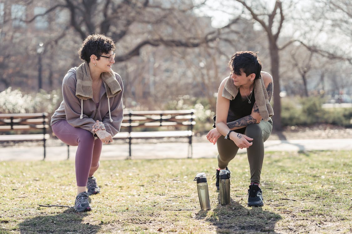 pexels-photo-7266760 image of two people exercising in a park