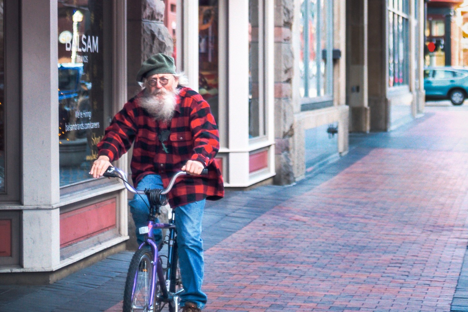 Old man cycling feeling great
