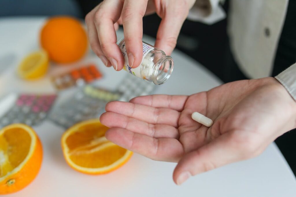 image of man measuring out enzyme supplements tablets from bottle