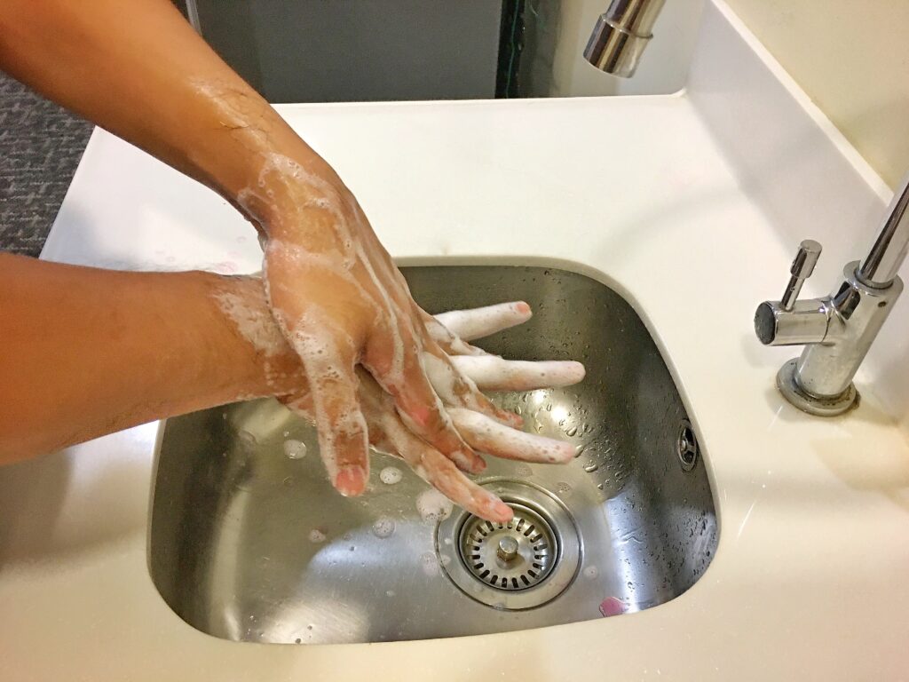 image of a person washing their hands